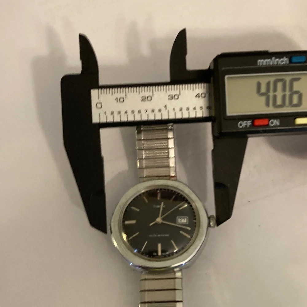 Vintage Timex watch, black dial, domed crystal, 2 straps, 1 leather, 1 stainless